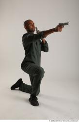 ERIC KNEELING POSE WITH GUNS
